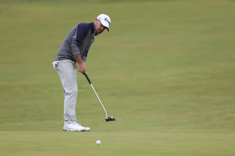 United States' Brian Harman putts on the 13th green during the third day of the British Open Golf Championships at the Royal Liverpool Golf Club in Hoylake, England, Saturday, July 22, 2023. (AP Photo/Peter Morrison)