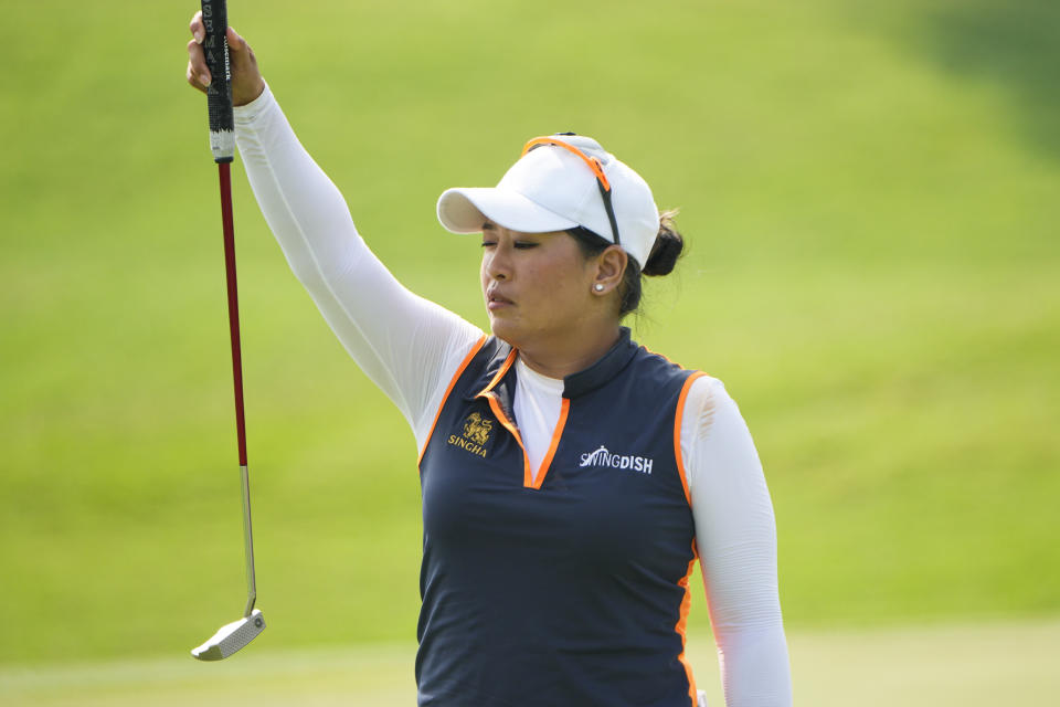 Jasmine Suwannapura of Thailand lines up a putt on the third green during the third round of the LPGA Maybank Championship in Kuala Lumpur, Malaysia, Saturday, Oct. 28, 2023. (AP Photo/Vincent Thian)