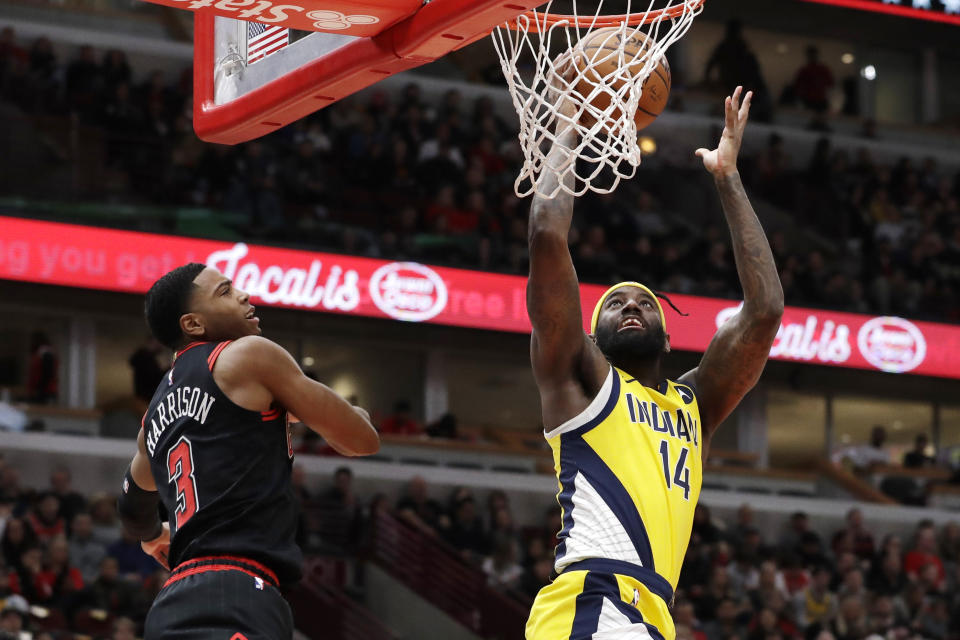 Indiana Pacers forward JaKarr Sampson, right, shoots next to Chicago Bulls guard Shaquille Harrison during the first half of an NBA basketball game in Chicago, Friday, March 6, 2020. (AP Photo/Nam Y. Huh)