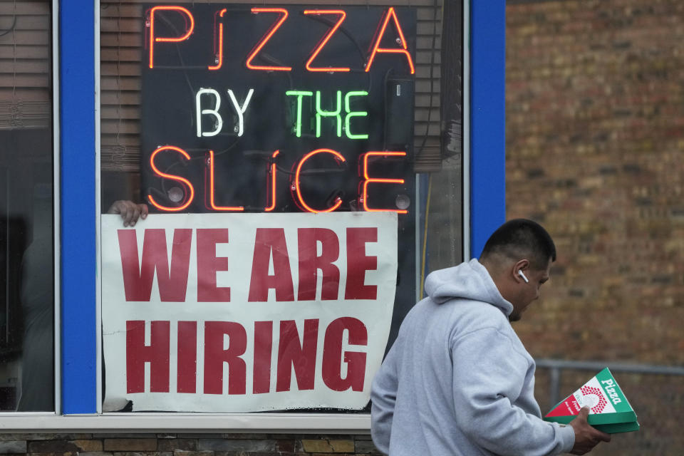 FILE - A hiring sign is displayed at a restaurant in Prospect Heights, Ill., on April 4, 2023. For more than a year, the U.S. economy has defied predictions of a forthcoming recession. It has withstood 10 interest rate hikes in 16 months from an inflation-fighting Federal Reserve. In June 2023, America’s employers added a healthy 209,000 jobs. (AP Photo/Nam Y. Huh, File)