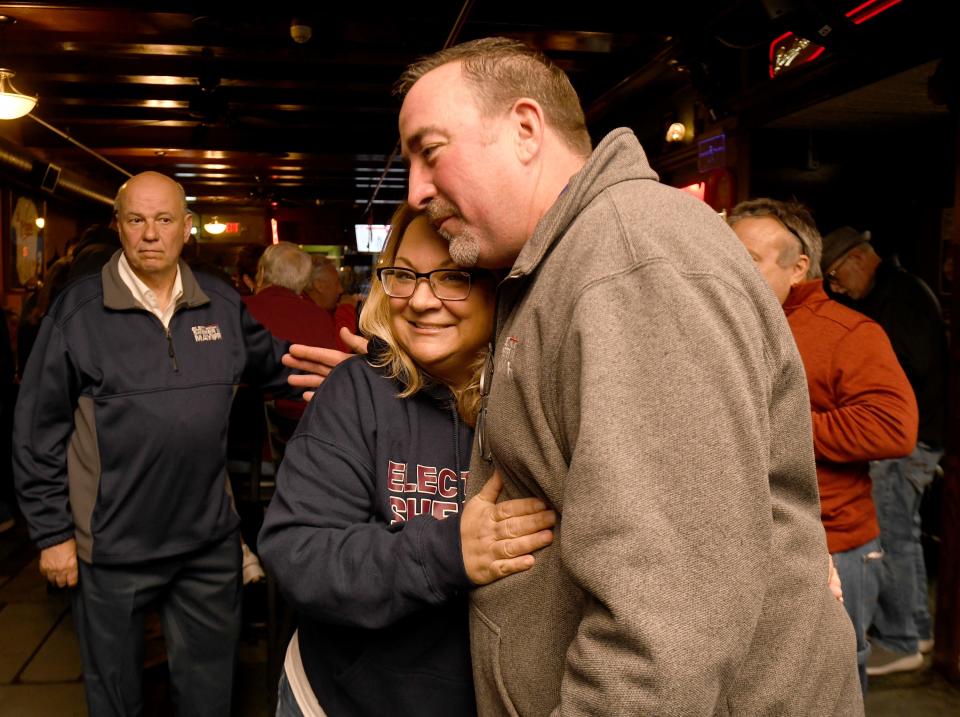 William V. Sherer II visits with supporters, including Cari McDermott, Canton Democratic Woman's Club vice president, as he waits for Democratic primary election day results.