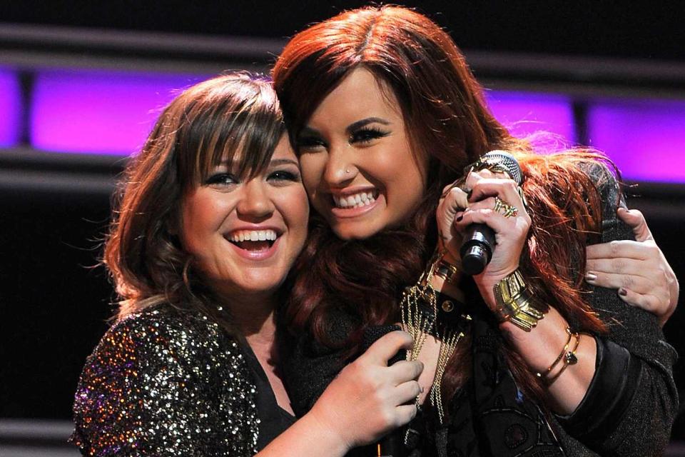 <p>Larry Busacca/WireImage</p> Kelly Clarkson and Demi Lovato