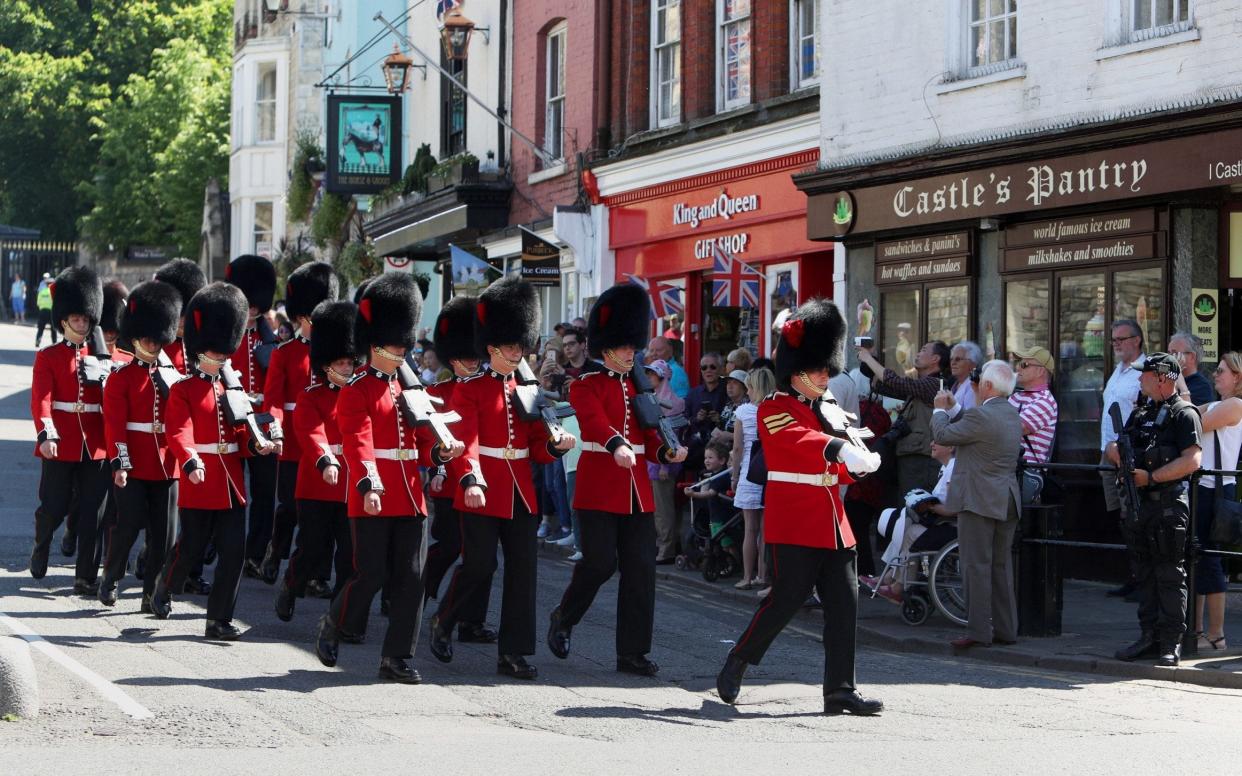 The Changing the Guard ceremony takes place outside Windsor Castle in Berkshire, after the event was cancelled on Wednesday in the wake of the Manchester attack. - PA