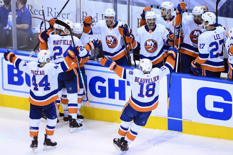 The New York Islanders celebrate after eliminating the Washington Capitals after an NHL Stanley Cup playoff hockey game in Toronto on Thursday, Aug. 20, 2020. (Nathan Denette/The Canadian Press via AP)