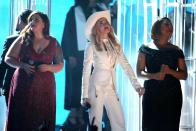 Mary Lambert, from left, Madonna, and Queen Latifah appear on stage during a performance of "Same Love" at the 56th annual Grammy Awards at Staples Center on Sunday, Jan. 26, 2014, in Los Angeles. (Photo by Matt Sayles/Invision/AP)