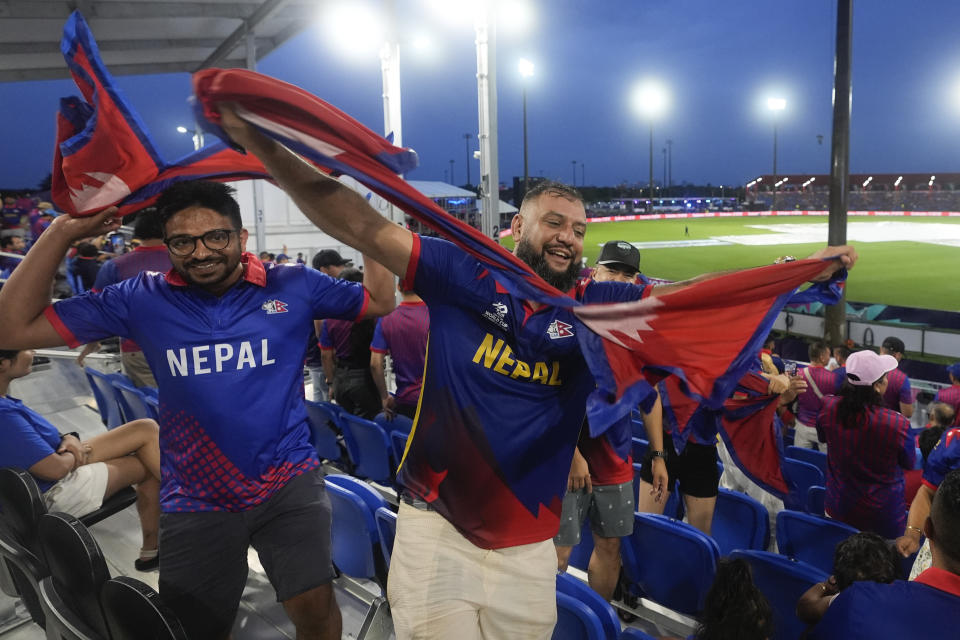 Nepal supporters react ahead of the men's T20 World Cup cricket match between Sri Lanka and Nepal at Central Broward Regional Park Stadium, Lauderhill, Florida, Tuesday, June 11, 2024. The match was abandoned due to rain. (AP Photo/Lynne Sladky)