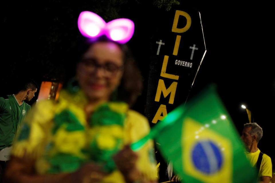 <p>A pro-impeachment demonstrator holds a cardboard coffin painted with the name of Brazil’s suspended president Dilma Rousseff during a protest in front of the National Congress, in Brasilia, Brazil, August 30, 2016. (REUTERS/Bruno Kelly) </p>