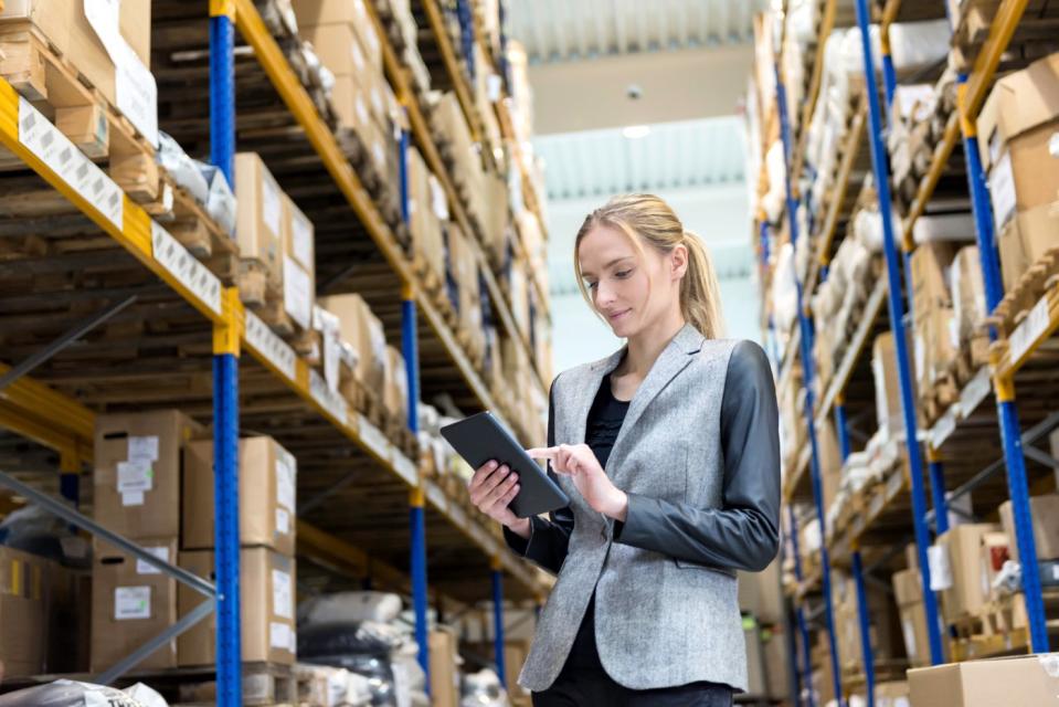 A person in a warehouse processing online orders.