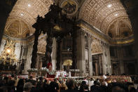 Pope Francis presides over a solemn Easter vigil ceremony in St. Peter's Basilica at the Vatican, Saturday, April 21, 2019. (AP Photo/Gregorio Borgia)