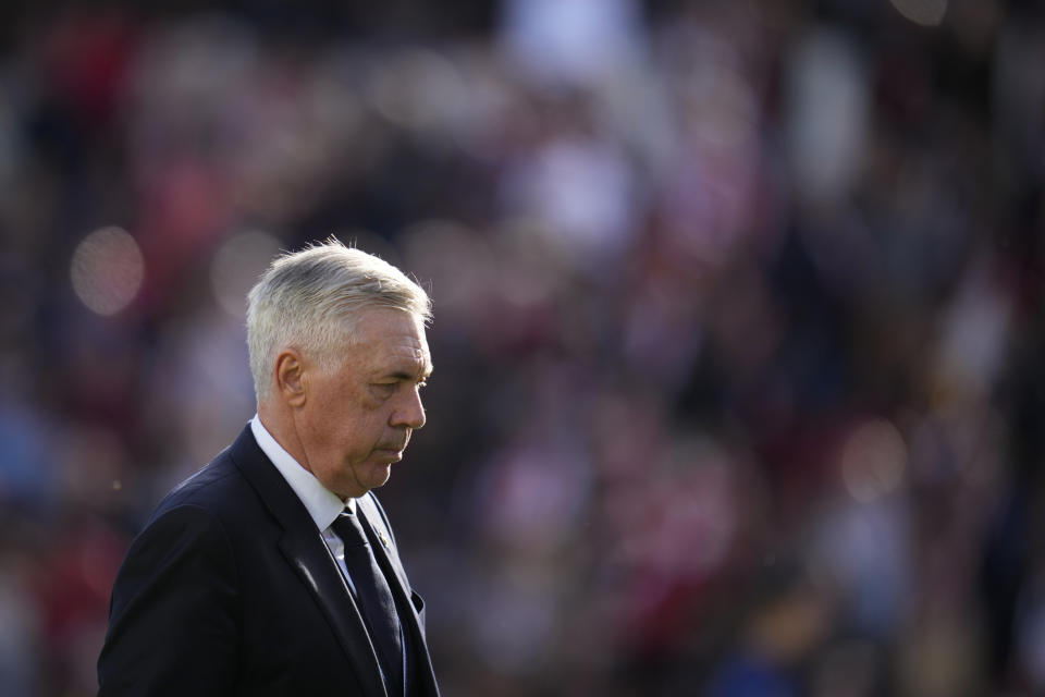 FILE - Real Madrid's head coach Carlo Ancelotti walks on the pitch at the end of the Spanish La Liga soccer match between Rayo Vallecano and Real Madrid at the Vallecas stadium in Madrid, Spain, Sunday, Feb. 18, 2024. Spanish state prosecutors have accused Real Madrid coach Carlo Ancelotti of alleged tax fraud. Prosecutors said in a statement Wednesday, March 6, 2024, that they are accusing Ancelotti of two accounts of tax fraud that would be punishable with four years and nine months of prison. (AP Photo/Manu Fernandez, File)