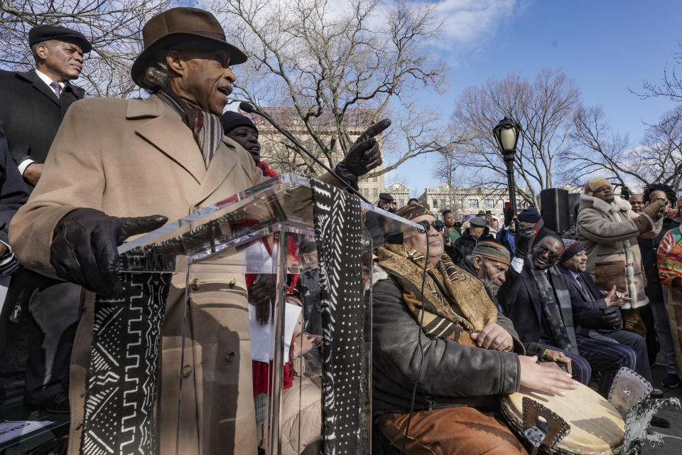 Civil rights leader Rev. Al Sharpton, at podium, speaks during a ceremony to name the northeast gateway of Central Park as "The Gate of the Exonerated," in honor of the five men exonerated after being wrongfully convicted as teenagers for the 1989 rape of a jogger in Central Park, Monday, Dec. 19, 2022, in New York. The entrance was named to honor Yusef Salaam, Raymond Santana Jr., Kevin Richardson, Antron McCray and Korey Wise, who were exonerated in the case. (AP Photo/Bebeto Matthews)