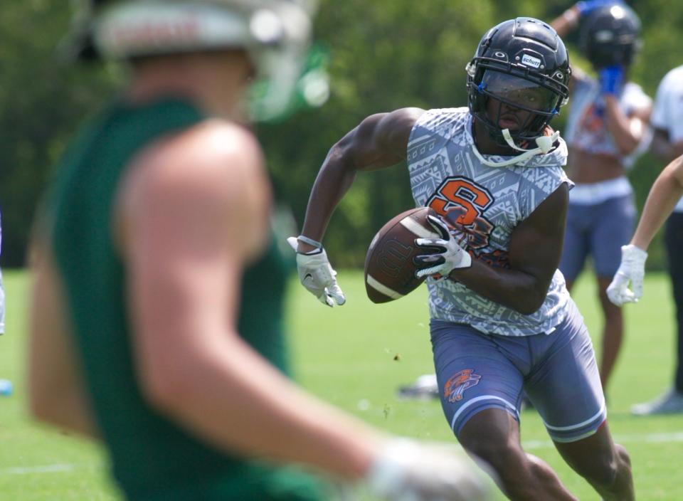 Seminole wide receiver Goldie Lawrence rushes the ball in a game during Mike Norvell's 7v7 High School Camp on June 15, 2022, at FSU Rec SportsPlex.