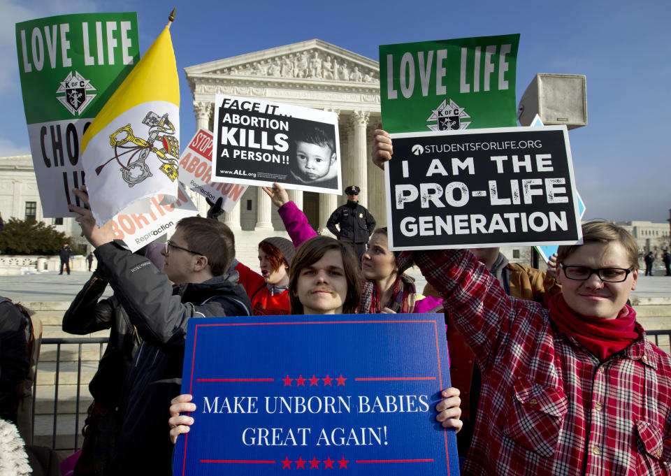 FILE - In this Friday, Jan. 18, 2019 file photo, anti-abortion activists protest outside of the U.S. Supreme Court, during the March for Life in Washington. President Trump's call for a ban on late-term abortions is unlikely to prevail in Congress, but Republican legislators in several states are pushing ahead with tough anti-abortion bills of their own that they hope can pass muster with the reconfigured U.S. Supreme Court. (AP Photo/Jose Luis Magana)