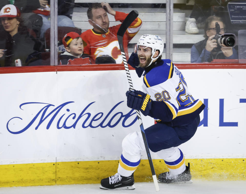 St. Louis Blues forward Brandon Saad (20) celebrates his game-winning goal during the third period of an NHL hockey game against the Calgary Flames in Calgary, Alberta, Tuesday, Jan. 23, 2024. (Jeff McIntosh/The Canadian Press via AP)
