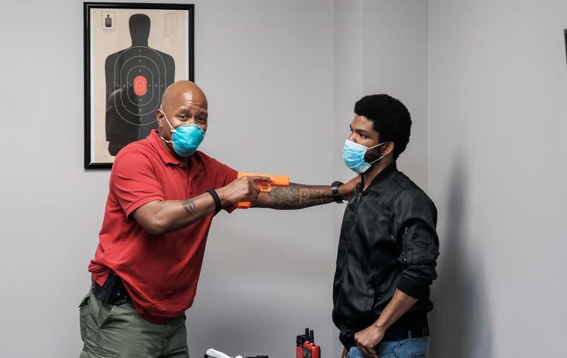 Former police Corporal Michael Brown conducts use of force training with special police recruits in Maryland