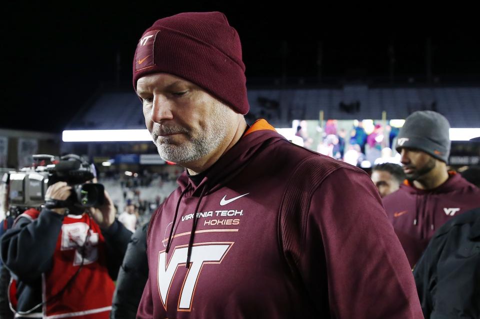 Virginia Tech head coach Justin Fuente walks off the field after losing to Boston College during an NCAA college football game, Friday, Nov. 5, 2021, in Boston. (AP Photo/Michael Dwyer)