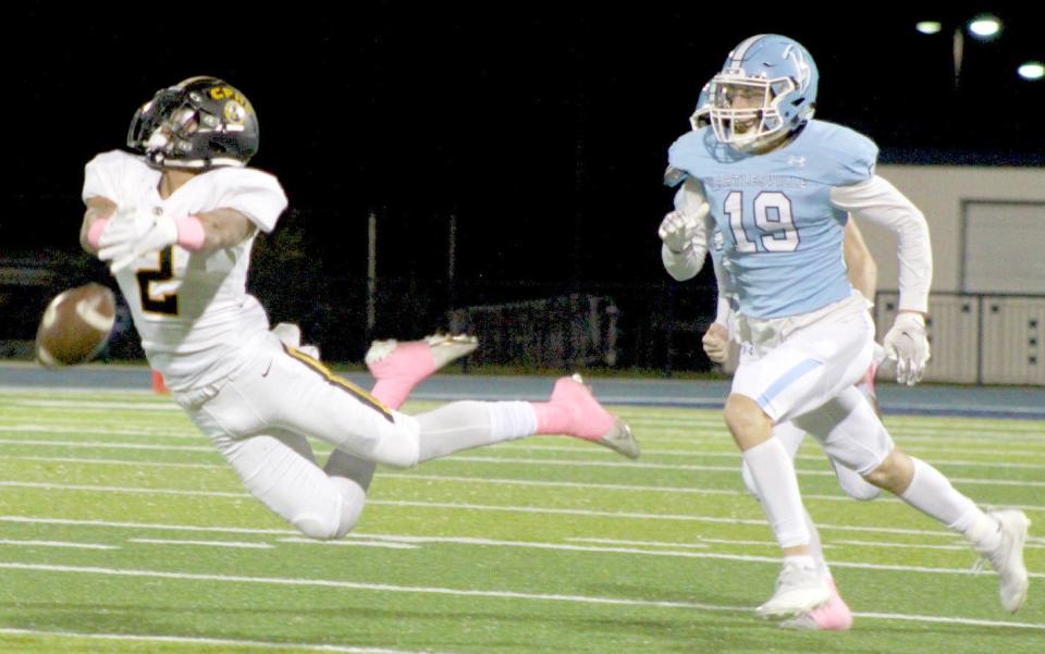 Bartlesville High defensive back Jet Scully, right, pressures a Sand Springs receiver into an incompletion during Friday's district battle at Custer Stadium. Sand Springs won, 41-20.