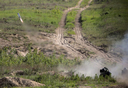 Ukrainian servicemen launch a missile during a test of the U.S. anti-tank missile systems at a shooting range in an unknown location, Ukraine May 22, 2018. Mikhail Palinchak/Ukrainian Presidential Press Service/Mikhail Palinchak/Handout via REUTERS