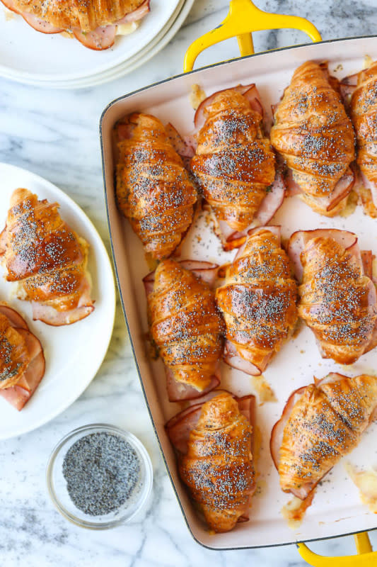 <p>Damn Delicious</p><p>These mini ham and cheese croissants are toasted and flaky, baked with Dijon-honey, buttery goodness.</p><p><strong>Get the recipe: <a href="https://damndelicious.net/2019/09/20/baked-ham-and-cheese-croissants/" rel="nofollow noopener" target="_blank" data-ylk="slk:Baked Ham and Cheese Croissants;elm:context_link;itc:0;sec:content-canvas" class="link rapid-noclick-resp"><em>Baked Ham and Cheese Croissants</em></a></strong></p>