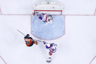 Philadelphia Flyers' James van Riemsdyk, left, scores a goal past New York Rangers' Igor Shesterkin, center, and Libor Hajek during the second period of an NHL hockey game, Wednesday, Feb. 24, 2021, in Philadelphia. (AP Photo/Matt Slocum)