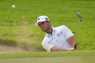 Luke List hits from the bunker on the first green during the third round of the Sony Open golf event, Saturday, Jan. 13, 2024, at Waialae Country Club in Honolulu. (AP Photo/Matt York)