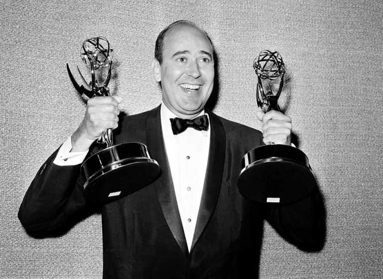 FILE - In this May 26, 1963 file photo, Carl Reiner shows holds two Emmy statuettes presented to him as best comedy writer for the "Dick Van Dyke Show," during the annual Emmy Awards presentation in Los Angeles. Reiner, the ingenious and versatile writer, actor and director who broke through as a "second banana" to Sid Caesar and rose to comedy's front ranks as creator of "The Dick Van Dyke Show" and straight man to Mel Brooks' "2000 Year Old Man," has died, according to reports. Variety reported he died of natural causes on Monday night, June 29, 2020, at his home in Beverly Hills, Calif. He was 98. (AP Photo, File)