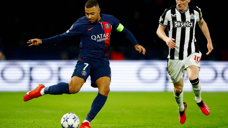 Paris St Germain's Kylian Mbappé in action with Newcastle United's Anthony Gordon on November 28, 2023. - Sarah Meyssonnier/Reuters