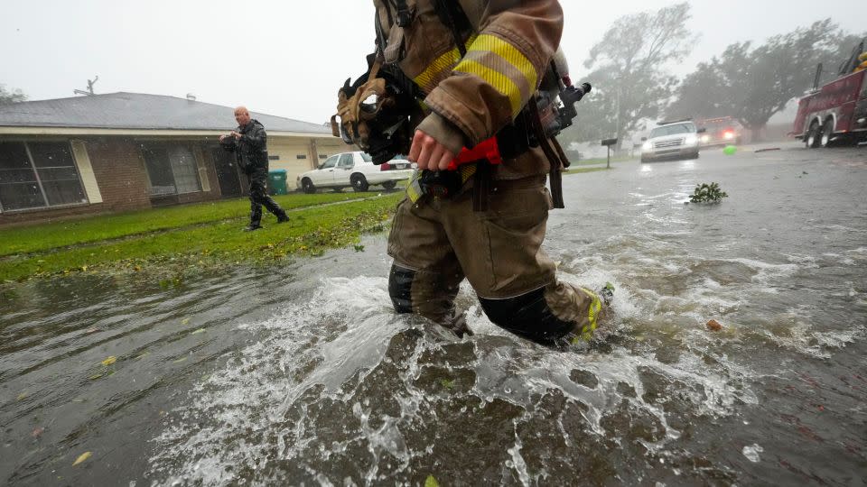 Morgan City firefighters respond to a home fire during Hurricane Francine in Morgan City, Louisiana, on Wednesday. - Gerald Herbert/AP