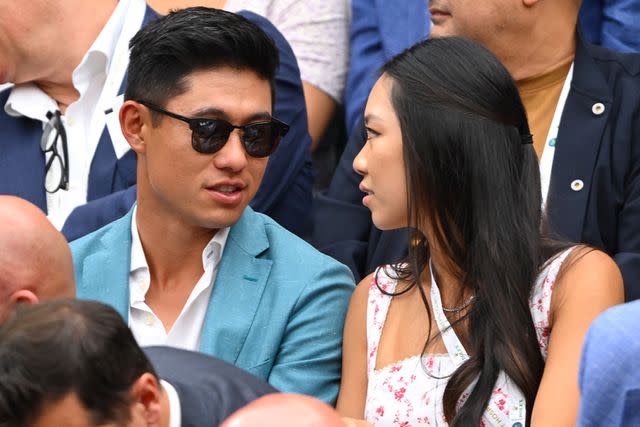 <p>Karwai Tang/WireImage</p> Collin Morikawa and Katherine Zhu at Wimbledon