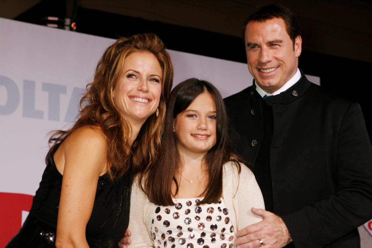 John Travolta and wife Kelly Preston pose with their daughter Ella Bleu Travolta at the premiere of their new film "Old Dogs" in Hollywood, California, on Nov. 9, 2009. All three star in the film with Robin Williams.