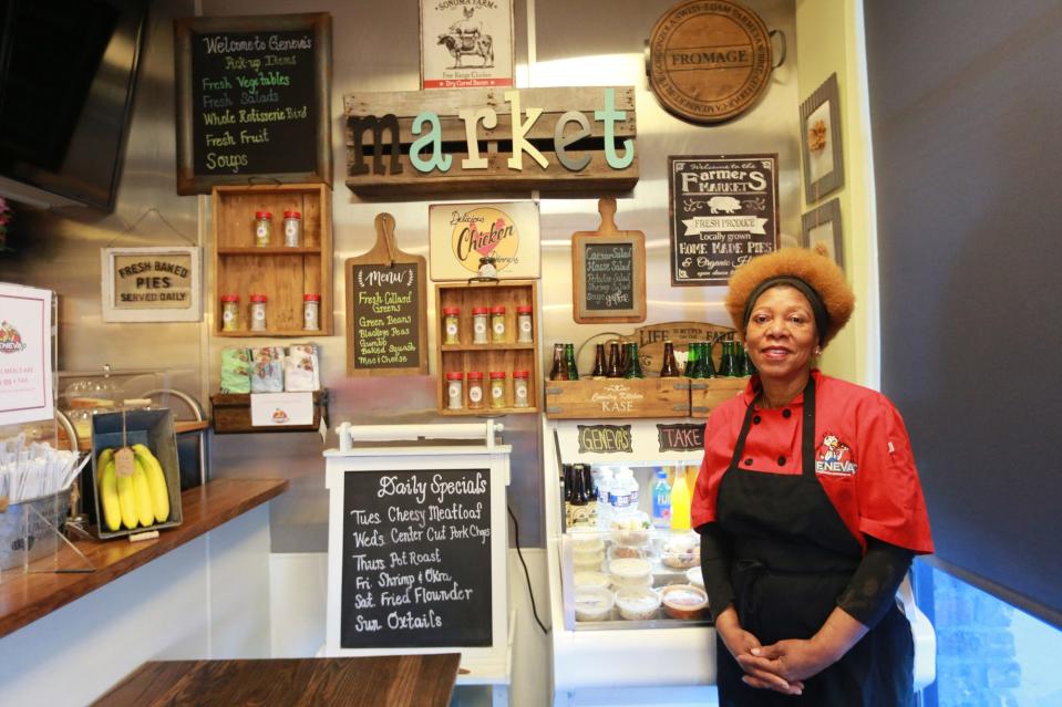 Geneva Wade stands near the grab and go cooler at Geneva's Famous Chicken and Cornbread Co. located in the Victory Square Shopping Center in Savannah.