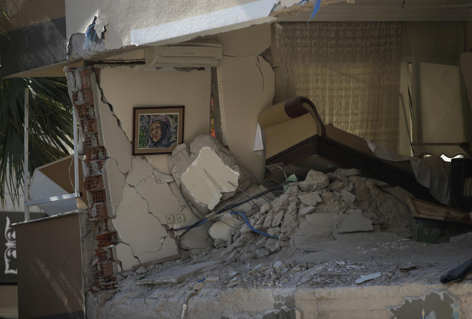 The interior of a destroyed living room of a family flat is seen after the building collapsed in Izmir, Turkey, Sunday, Nov. 1, 2020. Rescue teams continue ploughing through concrete blocs and debris of collapsed buildings in Turkey's third largest city in search of survivors of a powerful earthquake that struck Turkey's Aegean coast and north of the Greek island of Samos, Friday Oct. 30, killing dozens Hundreds of others were injured.(AP Photo/Emrah Gurel)