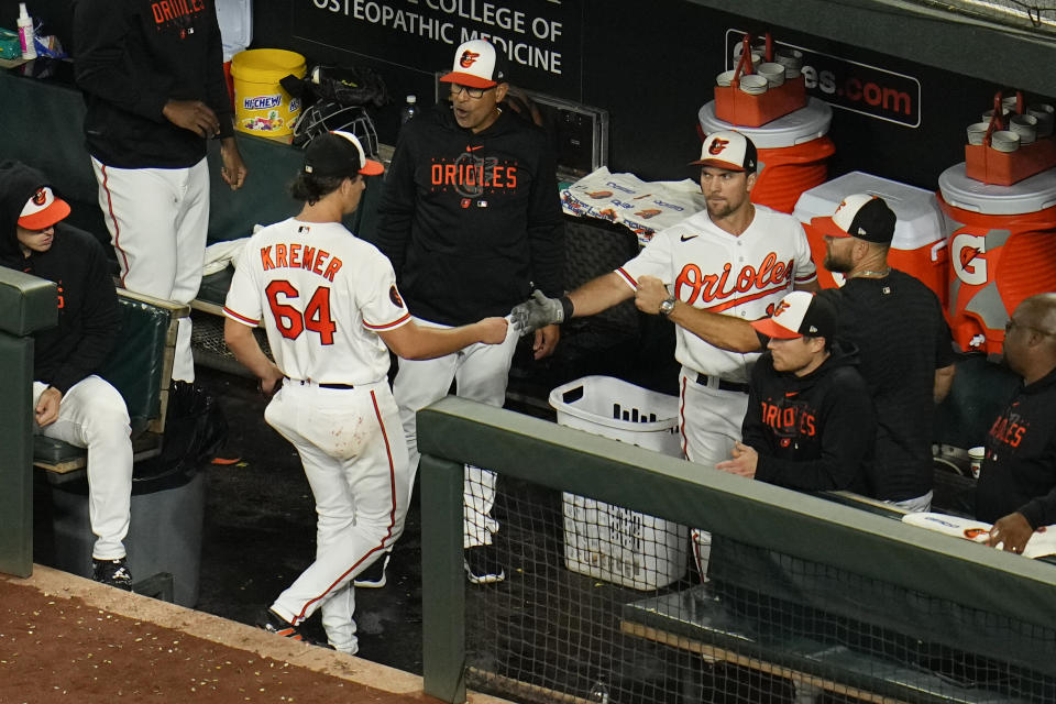 Baltimore Orioles starting pitcher Dean Kremer (64) reaches the dugout after being pulled for a reliever during the sixth inning of a baseball game against the Boston Red Sox, Thursday, Sept. 28, 2023, in Baltimore. (AP Photo/Julio Cortez)