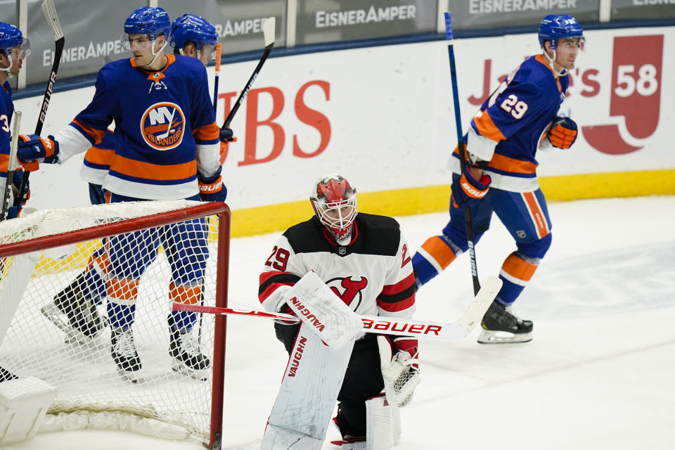 New Jersey Devils goaltender Mackenzie Blackwood (29) reacts as New York Islanders' Brock Nelson (29) skates toward his bench after scoring a goal during the second period of an NHL hockey game Saturday, May 8, 2021, in Uniondale, N.Y. (AP Photo/Frank Franklin II)