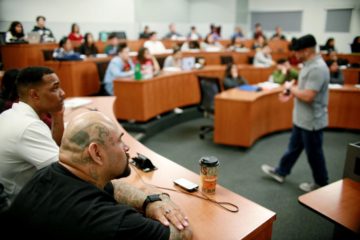 Martin Leyva and Tim Jackson listen to a class discussion on Thursday, April 12, 2018 at Cal State San Marcos in San Marcos, California. Higher education, Leyva said, helped him understand his own story within the nation’s larger socio-political framework. (Photo: Sandy Huffaker for Yahoo News)