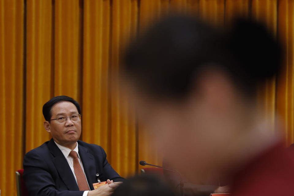 FILE- Then Jiangsu Communist Party Secretary Li Qiang attends a discussion group meeting held on the sidelines of China's 19th Party Congress at the Great Hall of the People in Beijing, Oct. 19, 2017. The pro-business track record of the man poised to become China's top economic official on Saturday, March 11, 2023 will make Li Qiang's term a test of whether he might moderate President Xi Jinping's tendency to intervene. (AP Photo/Andy Wong, File)