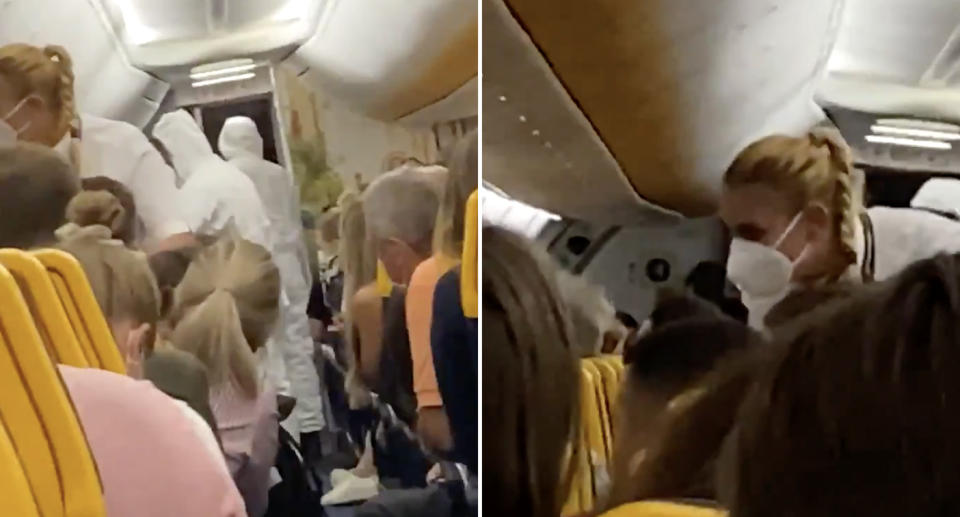 People in hazmat suits speak to a passenger on a packed Ryanair flight.