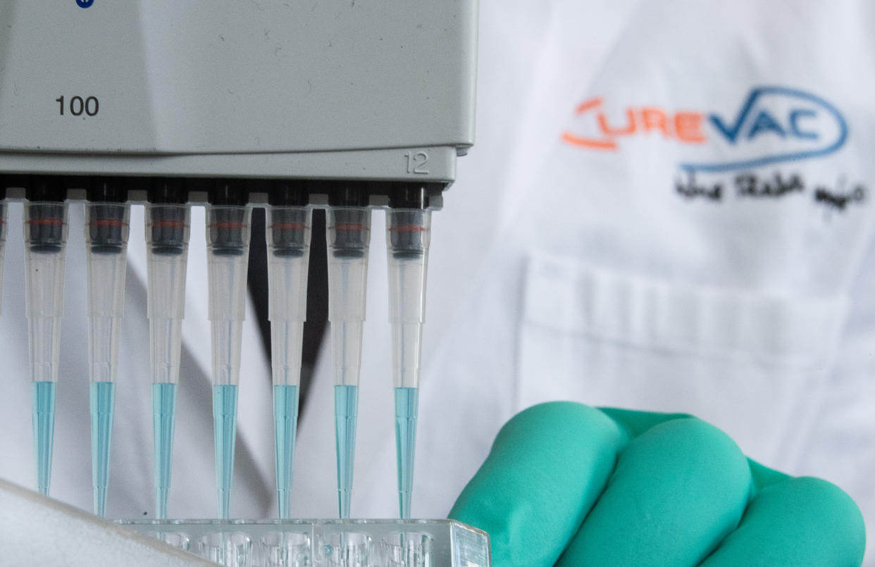 24 February 2020, Baden-Wuerttemberg, Tübingen: A man pipettes a blue liquid in a laboratory of the biopharmaceutical company Curevac. (to dpa: "Tübingen company tinkering with the enemy's profile") Photo: Sebastian Gollnow/dpa (Photo by Sebastian Gollnow/picture alliance via Getty Images)