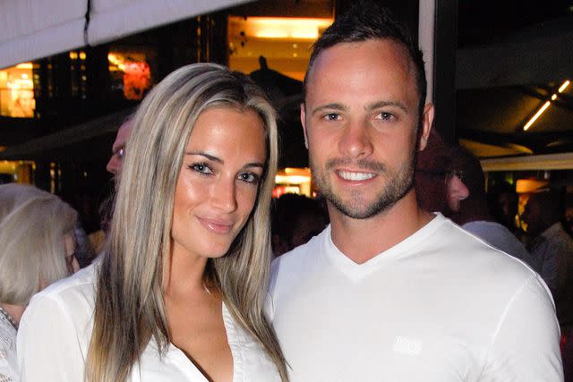 <p>WALDO SWIEGERS/AFP via Getty</p> Reeva Steenkamp and Oscar Pistorius in a photograph taken Jan. 26, 2013, just weeks before he fatally shot her that Valentine's Day.