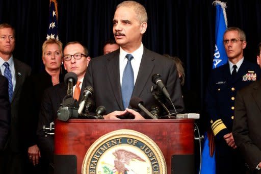 US Attorney General Eric Holder addresses the media while announcing new criminal charges in the case against the BP oil company. Holder noted that the Justice Department had "failed to resolve" a civil case to determine how much BP should pay in environmental fines