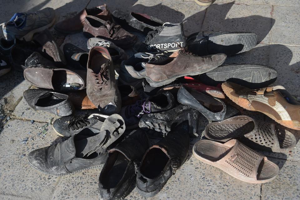 <p>Abandoned shoes belonging to victims after a bomb attack are pictured at a Shiite cultural centre in Kabul on Dec. 28, 2017. (Photo: Shah Marai/AFP/Getty Images) </p>