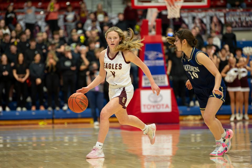 Silver Lake's Kailyn Hanni (4) dribbles down the court during State Basketball March. 8, 2024 at Hutchinson Sports Arena.