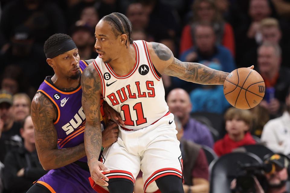 DeMar DeRozan #11 of the Chicago Bulls handles the ball against Torrey Craig #0 of the Phoenix Suns during the first half of the NBA game at Footprint Center on Nov. 30, 2022, in Phoenix, Arizona.