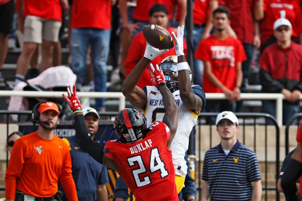 Texas Tech cornerback Malik Dunlap (24) breaks up a pass for West Virginia wide receiver Bryce Ford-Wheaton during the Red Raiders' 48-10 victory Saturday at Jones AT&T Stadium. Dunlap also had his first interception, one of four takeaways by the Red Raiders.
