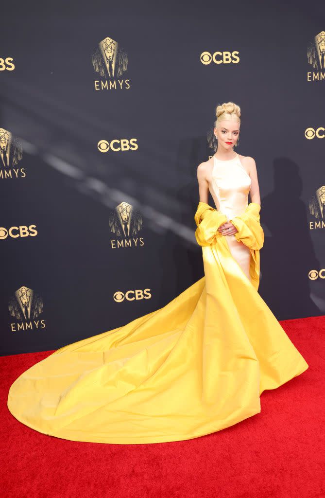 <p>Anya Taylor Joy and her stylist Law Roach are becoming a force to be reckoned with. The actress is one of the most exciting people to watch on the red carpet right now, and she did not disappoint for the 2021 Emmys, where she chose a beautiful cream satin gown by Dior Haute Couture with a dramatic yellow train.</p>