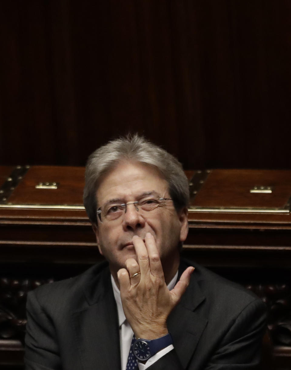 Italian Prime Minister Paolo Gentiloni sits in the parliament after giving his first speech as premier at the lower house where he will later face a confidence vote, in Rome Tuesday, Dec. 13, 2016. Paolo Gentiloni, a Democrat formerly serving as foreign minister, formed Italy’s new government Monday, keeping several key ministers from the coalition of Matteo Renzi, who resigned last week. (AP Photo/Alessandra Tarantino)