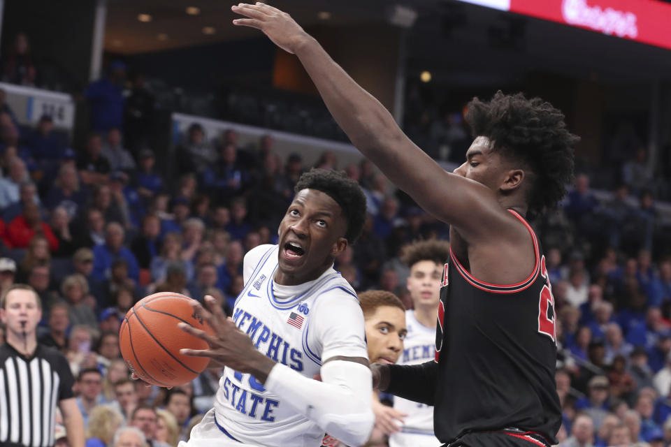 Memphis guard Damion Baugh (10) goes up for a basket as Georgia forward Rayshaun Hammonds (20) defends in the second half of an NCAA college basketball game Saturday, Jan. 4, 2020, in Memphis, Tenn. (AP Photo/Karen Pulfer Focht)