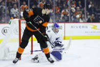 Tampa Bay Lightning's Andrei Vasilevskiy, right, blocks a shot as Philadelphia Flyers' James van Riemsdyk looks on during the second period of an NHL hockey game, Saturday, Jan. 11, 2020, in Philadelphia. (AP Photo/Matt Slocum)