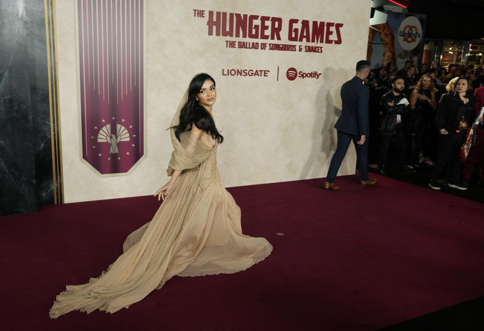 Rachel Zegler, a cast member in "The Hunger Games: The Ballad of Songbirds & Snakes," walks down the red carpet at the Los Angeles premiere of the film, Monday, Nov. 13, 2023, at the TCL Chinese Theatre. (AP Photo/Chris Pizzello)
