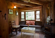 <p>Here’s a look at the cottage’s charming living room. (Airbnb) </p>